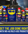 WD-40 multi-use products display including sprays and cans on a workshop table