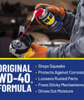 Person applying WD-40 Classic Formula on a tool to prevent corrosion and moisture, showcasing All Purpose Lubricant That Drives Out Moisture and Fights Rust.