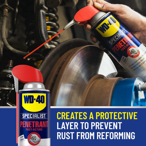 WD-40 Specialist fast rust relief penetrant with Smart Straw spraying rusted metal surface in workshop.