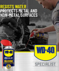 Man using WD-40 Specialist Silicone Lubricant with SMART STRAW SPRAYS 2 WAYS, 11 OZ on car engine