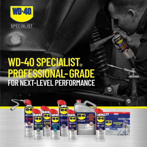 Mechanic using WD-40 Specialist Long Lasting Anti Rust Spray for metal parts, professional-grade products lined up, includes corrosion inhibitor