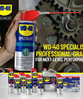Hand holding WD-40 Specialist White Lithium Grease Spray with SMART STRAW SPRAYS 2 WAYS, 10 OZ, near gears on a machine.