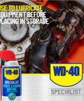 Close-up of WD-40 Specialist White Lithium Grease Spray with SMART STRAW SPRAYS 2 WAYS, 10 OZ near mechanical gears.