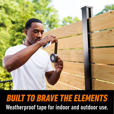 Man using Tough As Nails Industrial Strength Heavy Duty Double Sided Mounting Tape Weatherproof 1 Inch By 60 Inch Black Pack Of 2