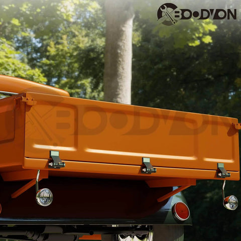 Rear view of a truck with Weld On Trailer Hinges With Grease Fitting Short Leaf Heavy Duty Dump Trailer Hinges installed.