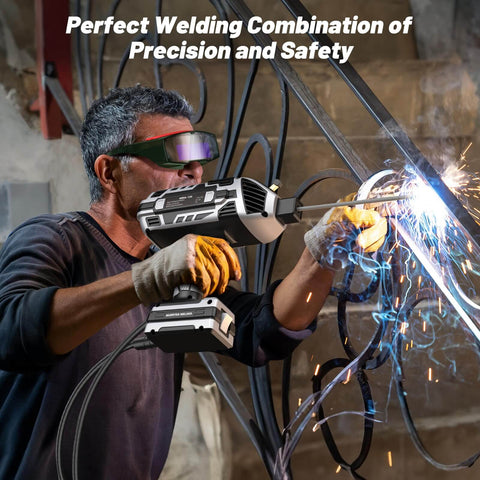 Man welding with Portable 110V Arc Welder With Auto Darkening Goggles IGBT Inverter Handheld Stick Welder in workshop