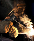 Heavy Duty Welding Electrode Holder Clamp With Copper Wire Leads in use during MMA ARC stick welding, sparks visible