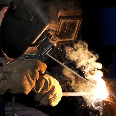 Heavy Duty Welding Electrode Holder Clamp With Copper Wire Leads in use during MMA ARC stick welding, sparks visible