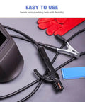 Welding tools and cables on table, including gloves, clamp, and helmet, for Stainless Steel Welding Nozzle Tip Cleaner Kit 13 Piece High Temp Resistant Torch Cleaning Set For Gas Welding Arc Welding Outdoor Repairs And Essential Welding Gear.