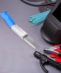 Stainless Steel Welding Nozzle Tip Cleaner Kit 13 Piece High Temp Resistant Torch Cleaning Set For Gas Welding Arc Welding Outdoor Repairs And Essential Welding Gear with protective welding helmet and tools on a workspace.