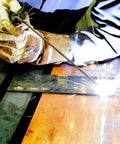 Person welding with Three Thirty Second Inch E6013 Welding Rod 5 Pound All Position for Easy Wetting and Smooth Beads, low spatter.