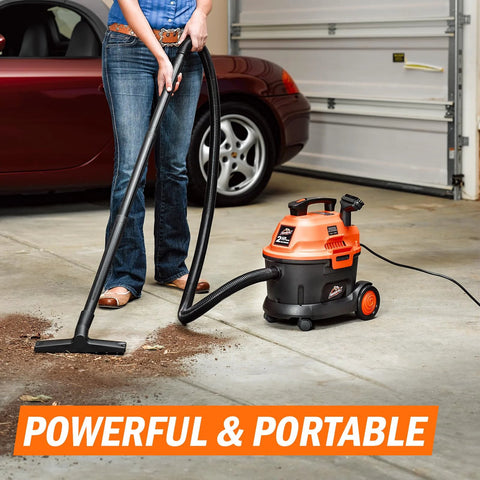 Wet Dry Vacuum, Two Point Five Gallon, 2 Peak HP, 120 Volt AC, Portable Compact Utility Vacuum With Blower in use on garage floor.