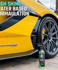 Ultra Wet Tire Dressing Spray Delivers Extreme Shine With Non Greasy Silicone Formula And UV Protection Preventing Sling Easy To Apply With Minimal Cure Time 16 Oz Water Based Finishes A Pristine Wet Look next to a yellow sports car wheel.