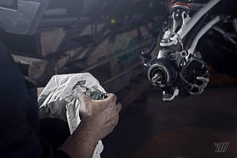 Mechanic using 44mm Wheel Bearing Greaser For Polaris RZR 900 1000 And Pro XP Jansen Motorsports on ATV UTV SxS