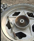 Oilless Bushing Sleeve Bearing 1.25 Inch Bore 1.40 Inch OD 1.17 Inch Length Self Lubricating displayed on a vehicle wheel.