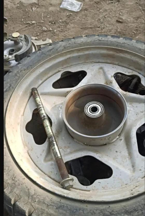 Oilless Bushing Sleeve Bearing 1.25 Inch Bore 1.40 Inch OD 1.17 Inch Length Self Lubricating displayed on a vehicle wheel.