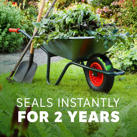 Wheelbarrow with garden tools and Slime 10193 Tire and Tube Sealant Puncture Repair Sealant, 2-in-1, Premium, 16oz Bottle for non-highway use