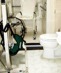 Bathroom with 67 Inch Collapsible Shower Threshold Water Dam installed for wheelchair accessible ADA showers.