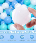Hand holding a white ball from Ball Pit Balls for Toddlers, BPA Free Crush Proof Plastic Toy Balls for Ball Pit, Children's Pool Water Toys Pack.