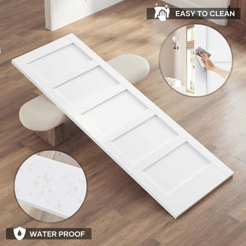 White 32x84 Inch Sliding Barn Door Slab With 5-Panel MDF Panels, Waterproof PVC surface shown in living room setting.