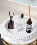 12 Inch White Beaded Lazy Susan Turntable for Tabletop and Countertop with decorative items arranged, featuring wood beaded edge.