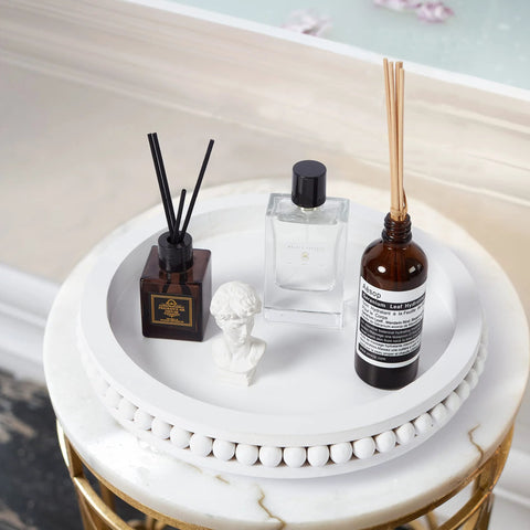 12 Inch White Beaded Lazy Susan Turntable for Tabletop and Countertop with decorative items arranged, featuring wood beaded edge.