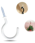 White ceiling hook with screw, holding ceiling with plant view, great for organizing or decor purposes.
