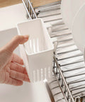 Cutlery Drying Rack - Utensil Drainer - Cutlery Drainer for Sink in white being attached to a dish rack near plates