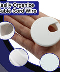 Person holding 2 Pack 1.5 Inch Desk Grommet Cable Hole Cover For Wire And Cord Organization White Plastic