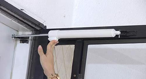 Installing Heavy Duty Door Closer System (White) on door frame, showing hands-free hold open feature.