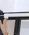 Hand installing Smooth - Dual Door Closer System - Heavy Duty on door, showcasing white, single-door unit for storm and security doors.