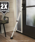 Sliding Door Stopper And Dual Function Security Bar For Hinged And Sliding Doors, Adjustable From Twenty Five And A Half Inches To Forty Three And A Half Inches, Indoor Use, Folding Design For Compact Storage And Travel, White, shown installed on a door.