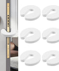 Six Pack Soft Foam Door Stoppers With Finger Guard Protectors in white shown on a door, 3.66 by 3.74 by 0.59 inches