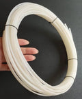 Person holding HDPE White Plastic Welding Rod 50 Feet 0.125 Inch Diameter for DIY Car Bumper Repair and other patch jobs
