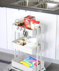 Sturdy 3-Tier Metal Utility Cart On Wheels In White, Heavy Duty Steel Frame With Durable Baskets, in kitchen