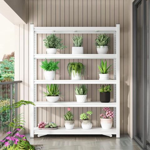 White metal shelving unit with potted plants on a patio, showcasing greenery and flowers in a neat arrangement.