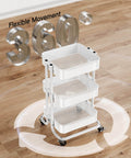 Three Tier Metal Rolling Utility Cart by Pipishell A Workhorse On Wheels With Two Lockable Wheels Great For Kitchen Dining Room And Living Room Storage And Organization Heavy Duty Mesh Shelves Mobile Serving Cart In White in a spacious room showing 360° rotation capability.