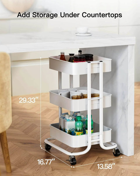 Three Tier Metal Rolling Utility Cart by Pipishell with lockable wheels, white mesh shelves holding bottles under a counter.