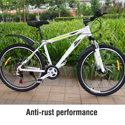 White mountain bike showcasing anti-rust performance on a garden path