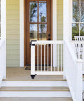 White porch gate with Heavy Duty Sliding Gate Kit Black Hardware Set for Smooth Quiet Sliding Gates with Secure Operation Easy DIY Installation.