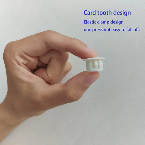 Hand holding a single White 30 Pack 13mm Plastic Hole Plugs For 12 To 13mm Holes Fits Half Inch Openings