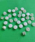White 30 Pack 13mm Plastic Hole Plugs For 12 To 13mm Holes Fits Half Inch Openings Great For Furniture DIY Projects Cabinets Speakers Panels And More For Any Project on green background
