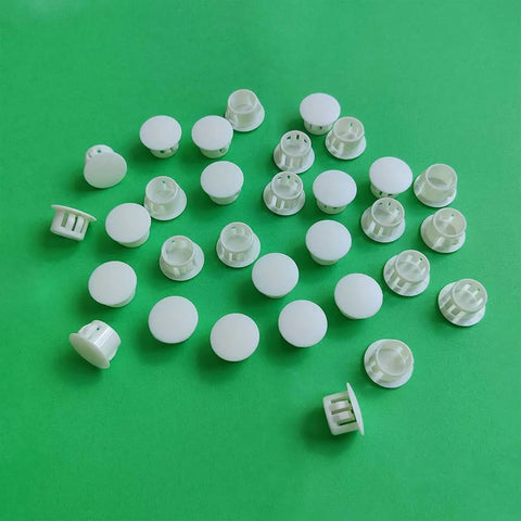 White 30 Pack 13mm Plastic Hole Plugs For 12 To 13mm Holes Fits Half Inch Openings Great For Furniture DIY Projects Cabinets Speakers Panels And More For Any Project on green background