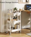 Versatile 3 Tier Rolling Cart With Locking Wheels Hanging Cups And Hooks Heavy Duty Metal Storage Organizer For Kitchen Office Bathroom Craft Room White next to desk