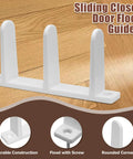 Sliding closet door floor guide, white, showing three vertical guides, fixed with screws, placed on wooden floor.