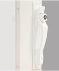White Push Button Heavy Duty Storm Door Latch With Keyed Lock Set installed on door, showcasing handle and lock mechanism close-up