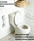 White strong suction cup handle no drilling installation in bathroom, shown on tile wall beside toilet, tool-free and stable.