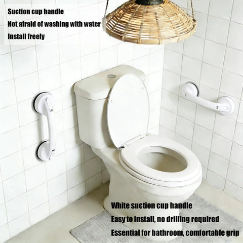 White strong suction cup handle no drilling installation in bathroom, shown on tile wall beside toilet, tool-free and stable.