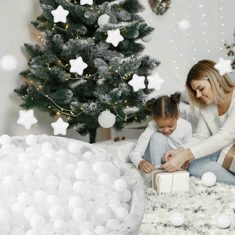 Child playing near Christmas tree with Ball Pit Balls Phthalate Free BPA Free Non-Toxic Crush Proof Play Balls for Toddlers Kids