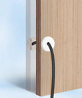 2 Pack Wall Grommets For Cables Pass Through Anti Slip Hole Covers For Walls And Furniture White installed on wood panel